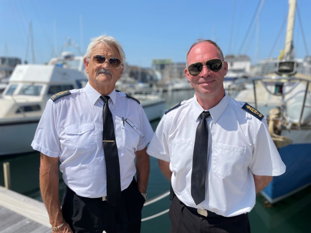 Current Harbour Master Pete Bromley (L) with new Harbour Master Mark Veale (R) in front of Sutton Harbour Marina.