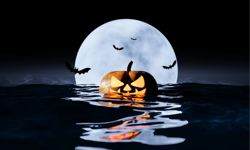 A Halloween jack-o-lantern floats in the sea surrounding by bats.