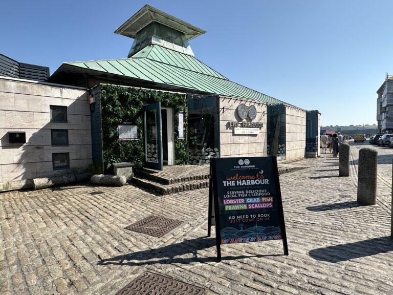 An exterior shot of The Harbour Seafood Restaurant on a sunny day